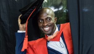 Dr Adegboyega Adedolapo Ola with his PhD in Conflict Transformation and Peace Studies.